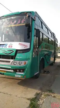 Pooja      Travels Bus-Side Image