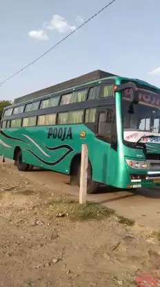 Pooja      Travels Bus-Side Image