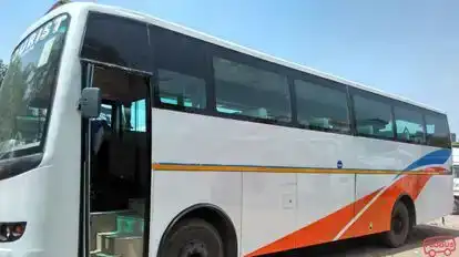 India Impact Tour and Travels Bus-Side Image