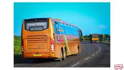 Laxmi holidays Bus-Side Image