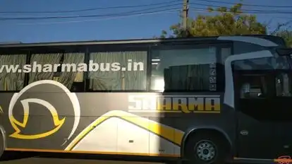 Sharma travel agency Bus-Side Image