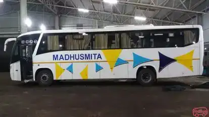 MADHUSMITA TOURS & TRAVELS Bus-Side Image