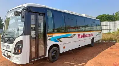 MADHUSMITA TOURS & TRAVELS Bus-Side Image