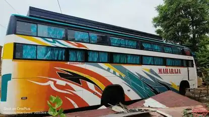 Khushi Tour. Travels Bus-Side Image