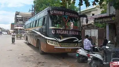 Popular Travels And Transport Bus-Front Image