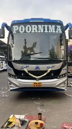 Poornima Tours Bus-Front Image