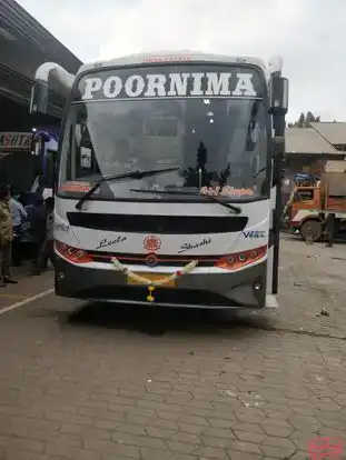 Poornima Tours Bus-Front Image