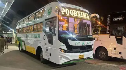 Poornima Tours Bus-Side Image