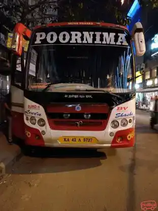 Poornima Tours Bus-Front Image
