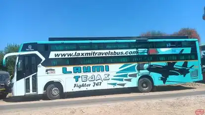 Laxmi Travels And Cargo Bus-Side Image