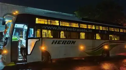 HERON TRAVELS Bus-Side Image