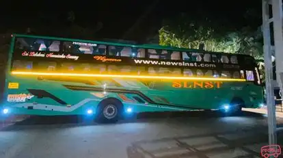 New Slnst Travels Bus-Side Image