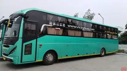 VICKY TRAVELS Bus-Side Image