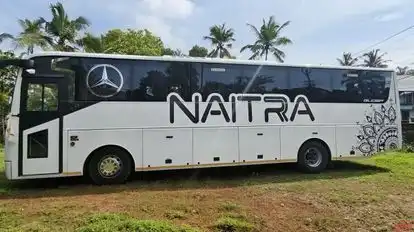NAITRA HOLIDAYS Bus-Side Image