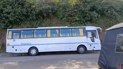 Wheels Tourist Transports Bus-Side Image