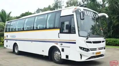 Wheels Tourist Transports Bus-Side Image